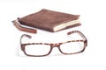 A picture of books, glasses