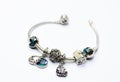 a picture of a bracelet that looks like it is made of silver with charms and Royalty Free Stock Photo