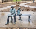 `Artist and Child`, a bronze sculpture by an unknown artist in McKinney, Texas.