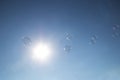 Bubbles floating in a blue sky in the summer Royalty Free Stock Photo