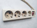 a picture of a burnt four-hole socket outlet, very dangerous, may start a fire