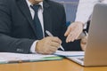 Business man hand signing on document with partner ,Asian women and men are doing business in the office, Business concept and Royalty Free Stock Photo