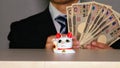 A businessman who got a lot of money with the profit of the beckoning cat