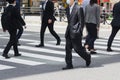 businessmen crossing a street in Tokyo, Japan Royalty Free Stock Photo