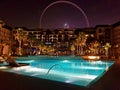 Picture of the Caesar Palace hotel from the pool side with the Bluewaters ferris wheel in background. Luxury background. Royalty Free Stock Photo