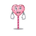 A picture of candy heart lollipop having an afraid face