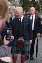 King charles III laughing with scottish citizen