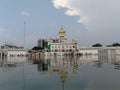 The picture captured the reflection of the gurudwara and the crowd around thhere in the water Royalty Free Stock Photo