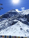 Picture captures a breathtaking winter landscape, featuring a majestic snow-capped mountain