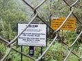 Notice board of Kerala State Electricity Board KSEB behind fence on Mattupetty dam in Kerala, India