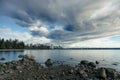 Stormy clouds looming over English Bay, while the West End stands in the distance, seen from the