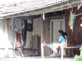 Small house in a village in India - women sitting on a cot - rural India scene Royalty Free Stock Photo