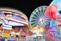 Carnival and Ferris Wheel at Night - Bright Lights and Long Exposure Royalty Free Stock Photo