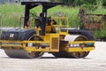 Picture of Caterpillar machine working on road construction. heavy work ongoing.