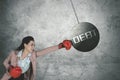 Caucasian businesswoman punching debt word