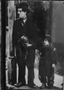 Picture of Charlie Chaplin and Jackie Coogan from the 1921 movie, `The Kid`.