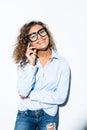 Picture of cheerful curly mulatto business girl wearing glasses over white background