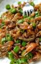 This is a Chinese delicacy, fried river shrimp with green pepper