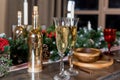 glasses for champagne, Christmas time decorations, New Year dinner, luxury home interior.Champagne and new year decor