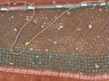 Picture of a clay tennis court drag mat or clay court sweeper.