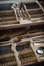 Close-up of a chic silver cutlery set in a wooden box