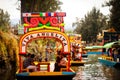 Picture of the colorful boats on ancient Aztec canals at Xochimilco in Mexico. Trajineras.