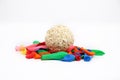 Picture of colorful deflated water balloons and cholai ke ladoo for holi fun Royalty Free Stock Photo