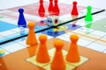 Picture of colorful pawns on the ludo game