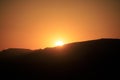 Colorful sunset over a desert mountain landscape Royalty Free Stock Photo