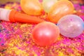 Picture of colorful water balloons and pichkari for holi fun