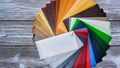 The picture with the colour samples of laminated films for the banner design. Dark background. Design material Royalty Free Stock Photo