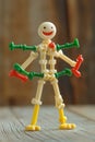 Picture of a comical toy robot dancing happily while standing on wood Royalty Free Stock Photo