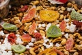 A picture of a composition of various dried fruit on a market