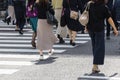 crowds of people crossing a city street in Tokyo, Japan Royalty Free Stock Photo