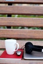Picture of cup,book, watch,headphone and laptop
