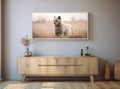 picture of a cute animal on the wall above a piece of furniture in a living room