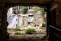 Picture for decoration of a vintage retro interior. Odessa. An old authentic courtyard with an arch and dried clothes on the ropes Royalty Free Stock Photo