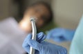 Picture of a dentist`s hand taking an orthodontic machine.