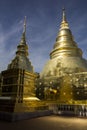 Two golden pagodas in Thai Buddhist temple in Chiang Mai Royalty Free Stock Photo