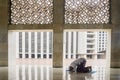 Devout man doing Salat on the Istiqlal mosque