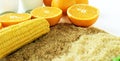 Commodity close up with milk, metal, oranges, corn, rice and soybeans Royalty Free Stock Photo