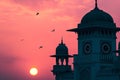 A picture of the dome and a clock tower in a Mosque at sunset or sunrise, the tallest clock tower Royalty Free Stock Photo