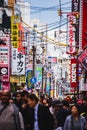 A picture of Dotonbori street filled with people and restaurant signs.