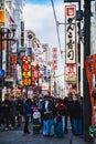 A picture of Dotonbori street filled with people and restaurant signs.