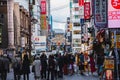 A picture of Dotonbori street filled with people and restaurant signs.