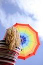 Picture of elegant woman holding rainbow umbrella Royalty Free Stock Photo