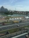A picture from an elevated place of the lake And for the streets and buildings in the city of Minsk