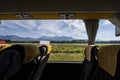 Large window in an empty bus with modern seats with the slovenian mountains of the Julian alps in background, taken from motorway Royalty Free Stock Photo