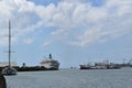 Picture of the entrance of a port with a beautiful and large sailing boat on the left Royalty Free Stock Photo