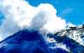 Erupting Arenal Volcano masked in clouds Royalty Free Stock Photo